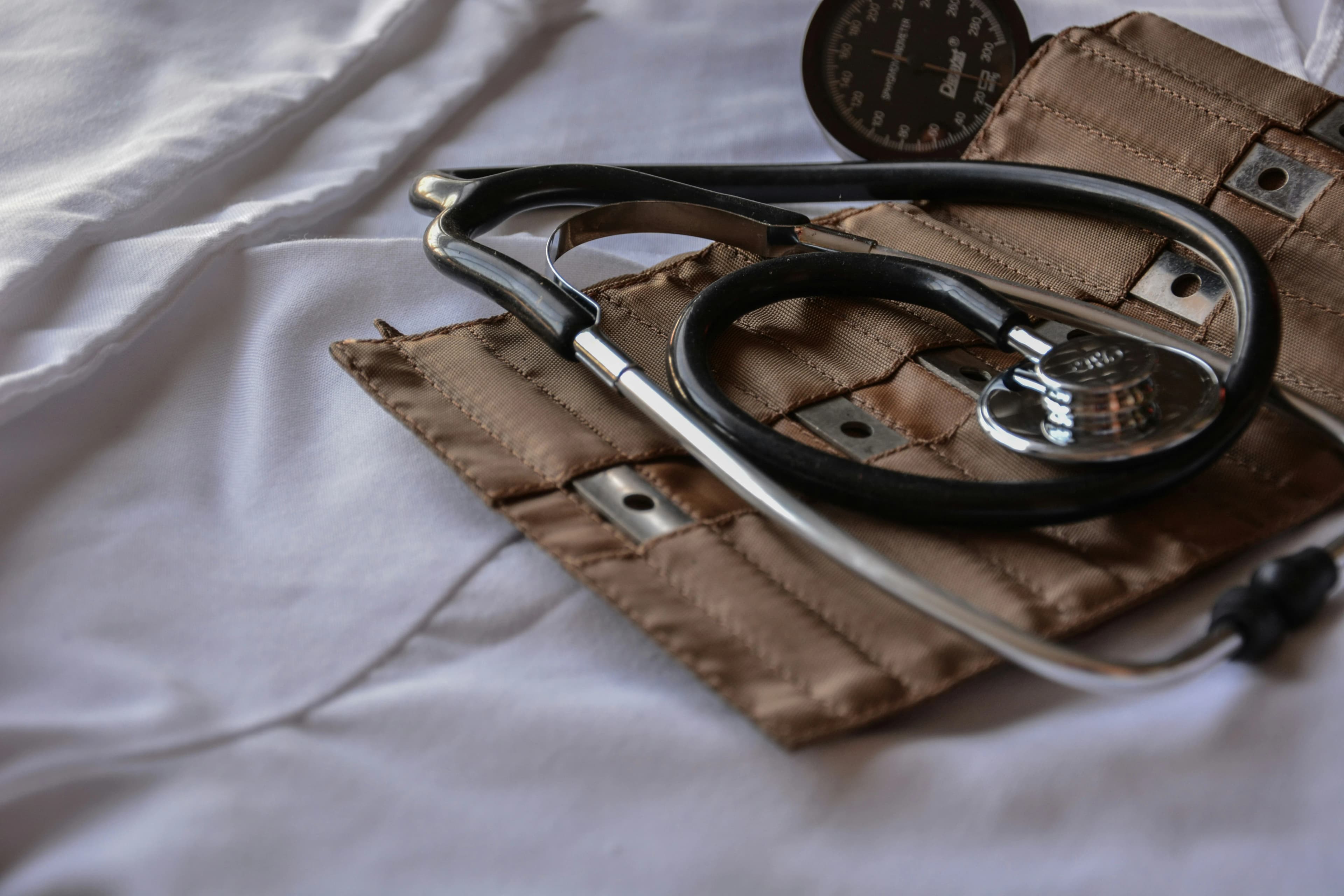 Modern healthcare facility with medical professionals using digital technology for patient care and electronic health records