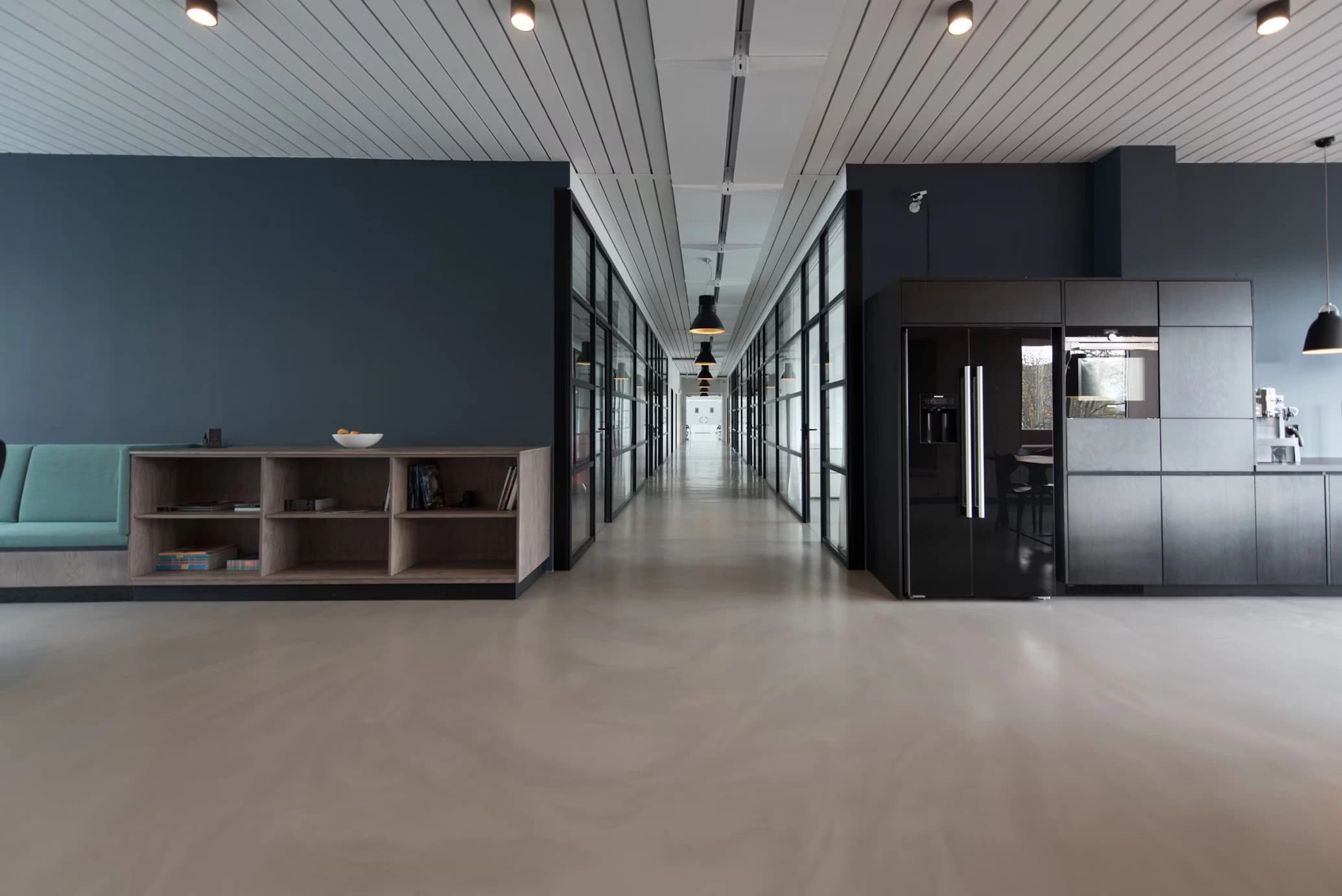 Clean modern office workspace with laptops, coffee, and collaborative technology setup showcasing professional business environment