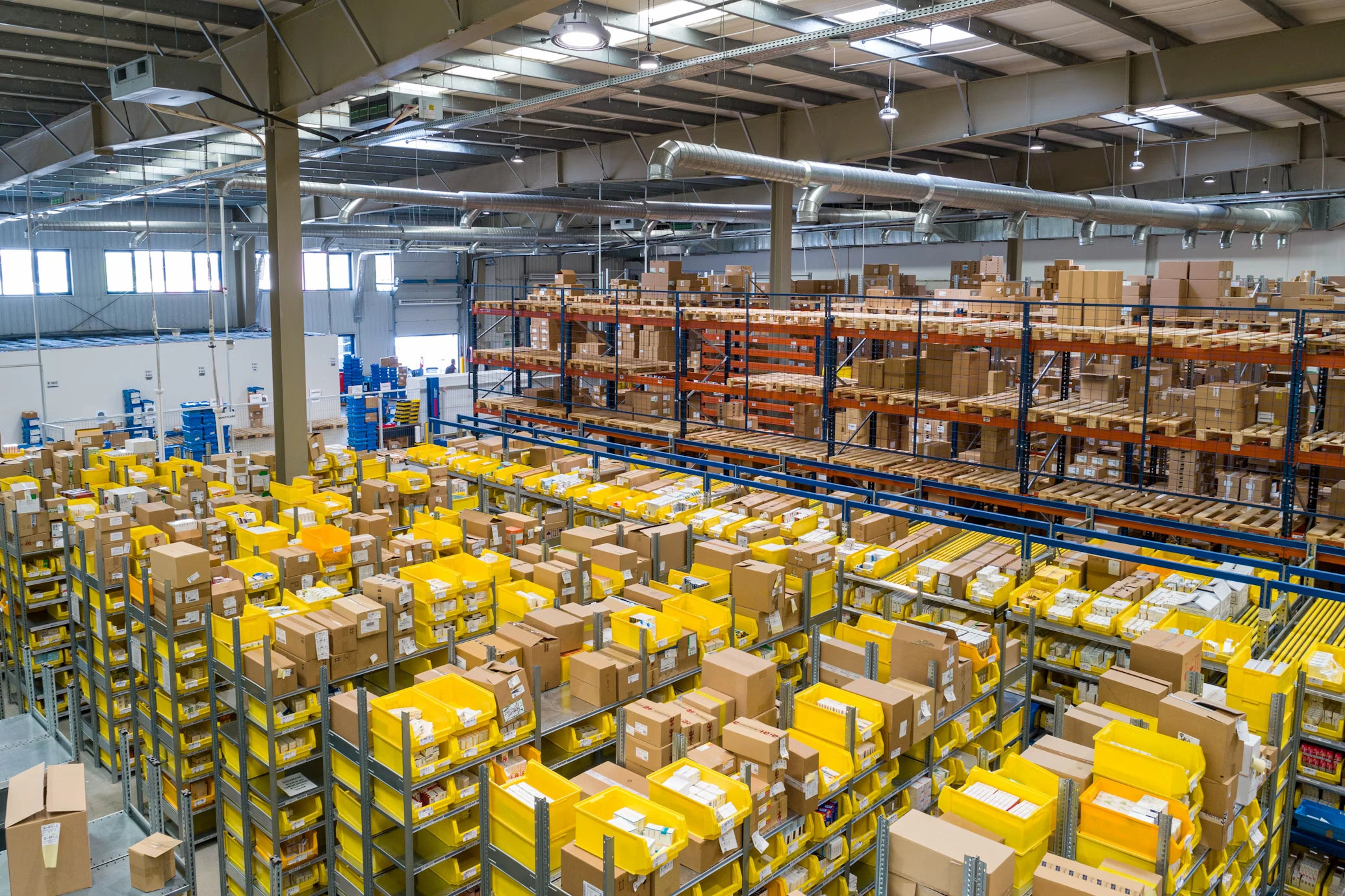 Modern logistics warehouse with automated tracking systems, fleet management technology, and supply chain optimization tools