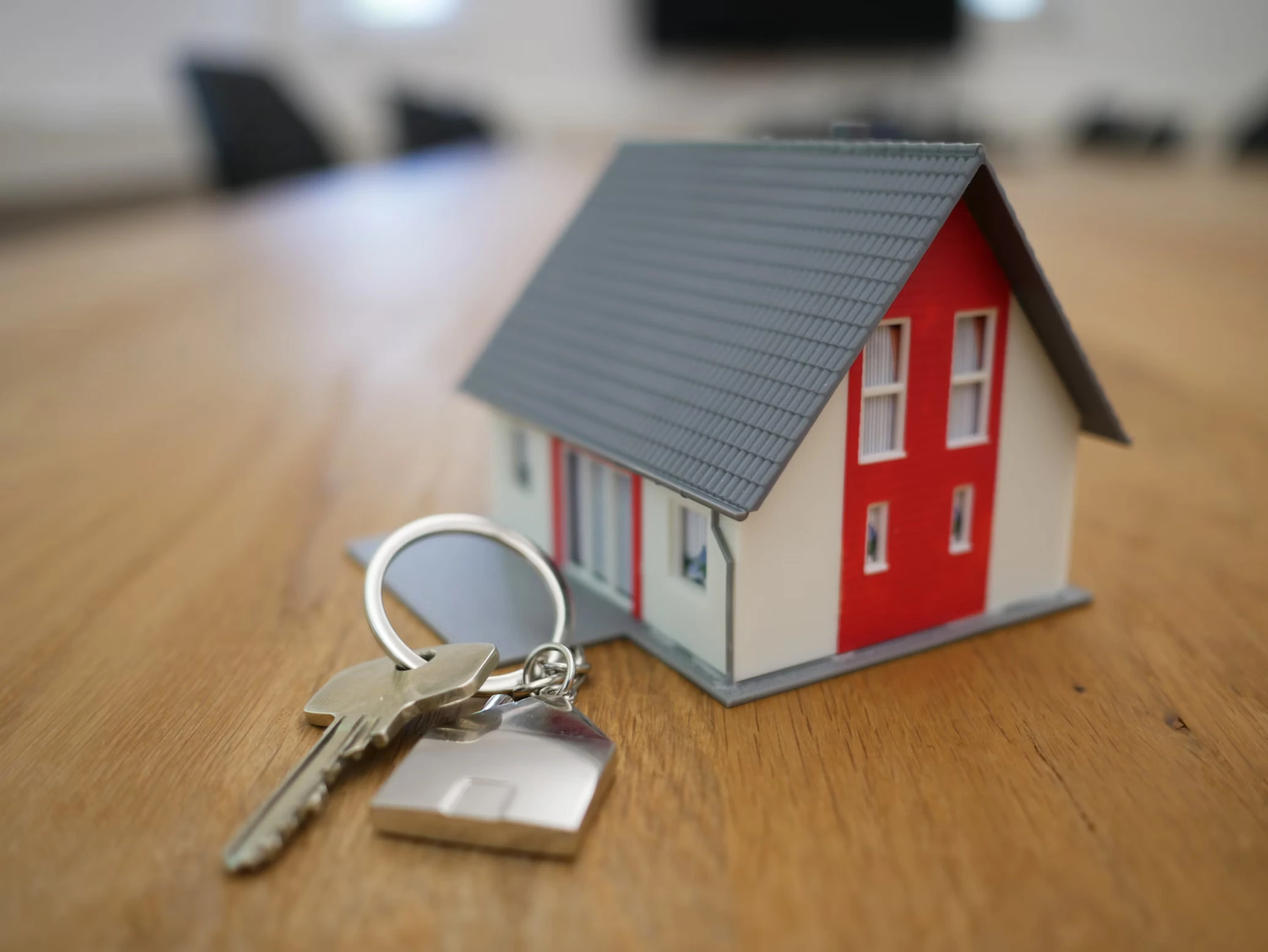 Real estate professionals using property management software, virtual reality tours, and digital transaction platforms
