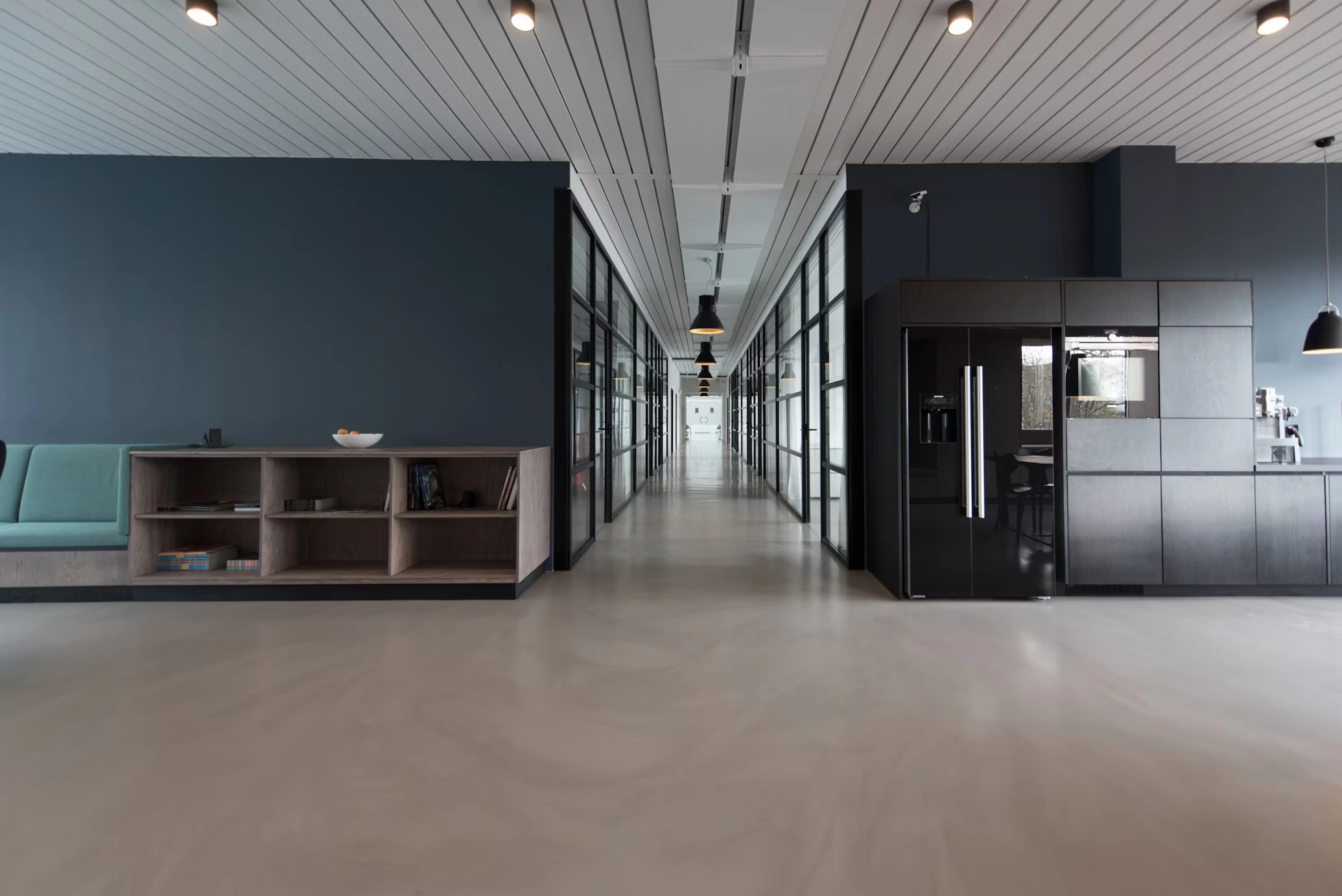 Clean modern office workspace with laptops, coffee, and collaborative technology setup showcasing professional business environment